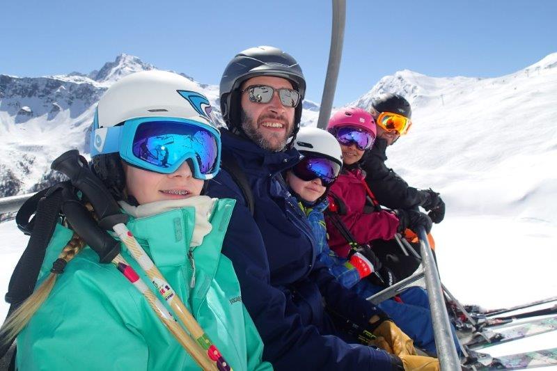 Family on chairlift in La Plagne